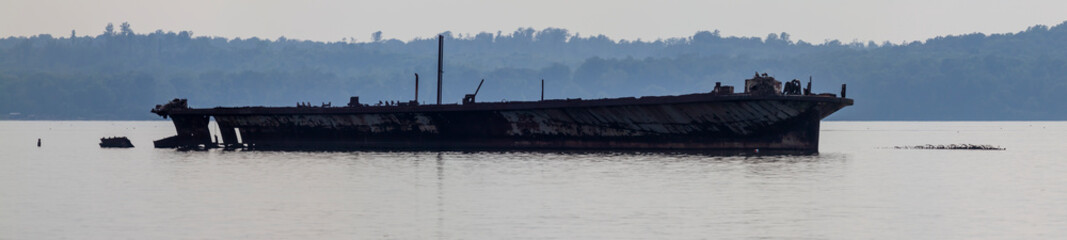 Panorama of an abandoned ship in Mallows bay of Potomac river. This place is home to remains of...