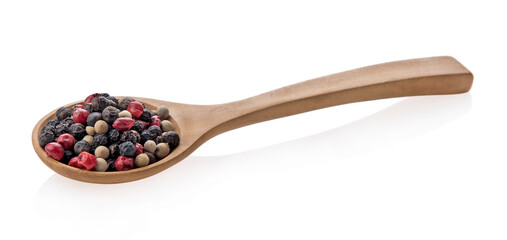 dried mix peppers in wood spoon isolated on white background