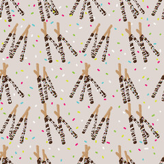 chocolate covered stick pretzels and sprinkles seamless pattern on beige background design