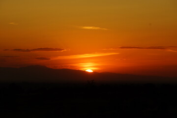 Sunset with clouds and mountains