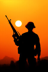 The silhouette of a military soldier with the sun as a Marine Corps for military operations