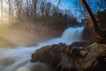 waterfall on a foggy morning