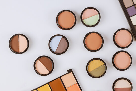 Set of eyeshadows in pastel beige colors pallet brown matte shadows, closeup of makeup product on an isolated white background