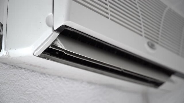 Air conditioner with open horizontal jalousies in room