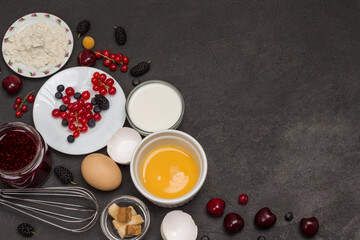 Frying pan with cereal pancakes. Flour, berry yogurt, butter, honey jam.
