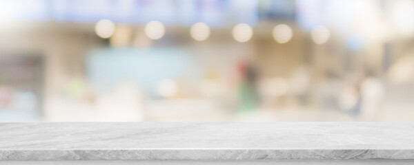 Empty white marble stone table top and blur glass window interior restaurant banner mock up abstract background - can used for display or montage your products.