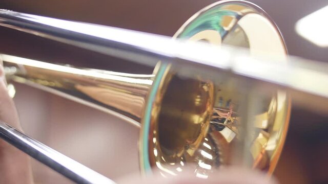 orchestra musician playing trombone slow motion