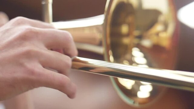 orchestra musician playing trombone slow motion