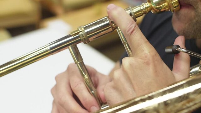 orchestra musician playing trombone slow motion