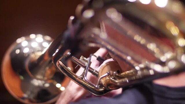 orchestra musician playing trombone slow motion
