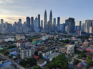 Fototapeta premium Kuala Lumpur, Malaysia - July 20, 2020: View of Kuala Lumpur skyline during sunrise.