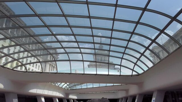 Palace of the Bulgarian National Assembly seen from entrance to the underground station Serdika, a modern building with a glass ceiling preserving the historical ruins of the ancient Roman city
