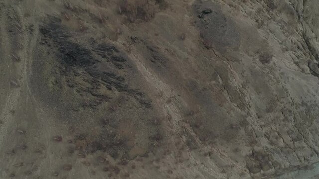 Mountain Karabash without plants due to terrible ecology. On the top of the mountain an Orthodox cross and the title &ldquo;Bless and save&rdquo;. Karabash city, Chelyabinsk region, Russia