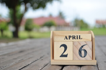 April 26, Number cube with a natural background.