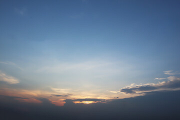 Dramatic atmosphere panorama view of beautiful twilight sky with golden sunlight and clouds on summer clear blue sky.