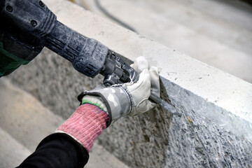 Adjust the surface of concrete with a chipper: concrete chipping construction