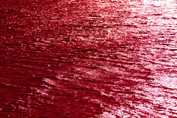 Water sea surface tinted in burgundy color.