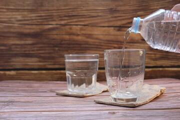 Glasses of water on the table background and space for text 