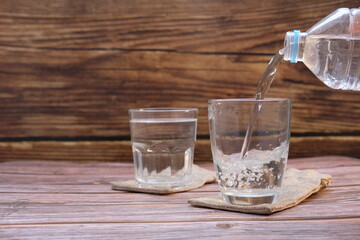 glass of water on wooden table