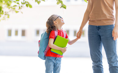 Parent and pupil go to school