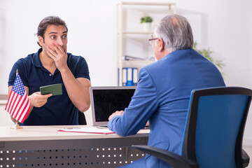 Young man visiting embassy for visa application
