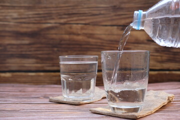 pouring water into glass