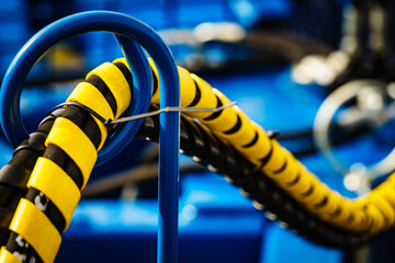 Hydraulic connections hoses in spiral wrap - obrazy, fototapety, plakaty