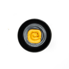 black plate with a Jam Rolls