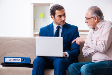 Young male lawyer visiting old man in testament concept