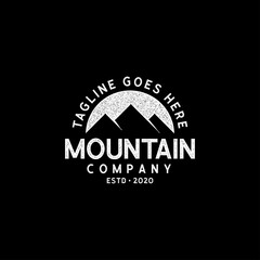 Mountain logo grunge textured vector. Adventure, outdoor, nature, landscape symbol illustration