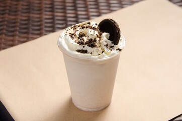 white milkshake with ice cream garnished with cookies