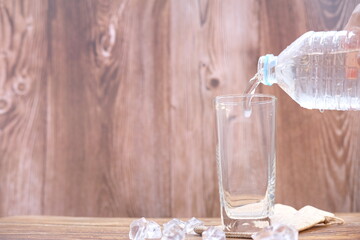 glass of water on wooden table