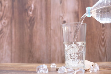 glass of water on wooden table