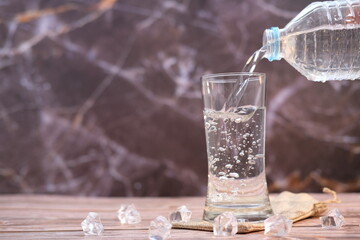 pouring water into glass