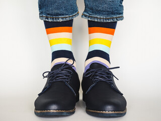Men's legs, trendy shoes and bright socks