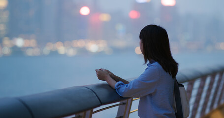 Woman look at the city at night