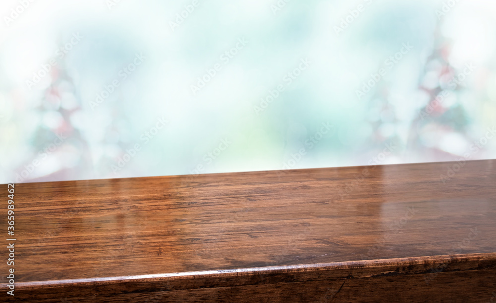 Aufkleber Perspective wood table with blur Christmas tree decorate string light and blue bokeh with snow light.Panoramic wooden countertop banner mock up for product display greeting card design online content