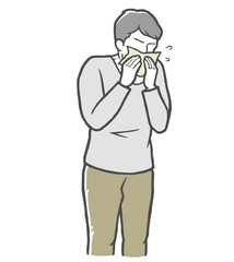 長袖を着て鼻をかむ若い男性