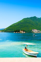 Plakat Beautiful shore in Perast town and view of St. George island in Kotor bay, Montenegro. Famous travel destination.