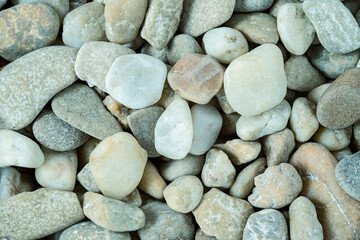 Fototapeta na wymiar natural background, stones and pebbles on dry riverbed, macro