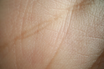 Close up of person hand texture upwords to camera with individual life fate lines and stamp