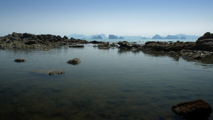 Lake beside the sea landscape at island on the morning rain season day.