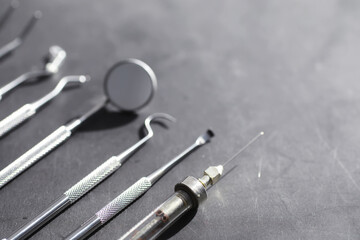 Fototapeta premium Equipment for the dental office. Orthopedic Instruments. Dental technician with working tools. Dentist metal tools.