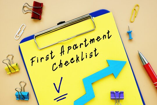 Financial Concept About First Apartment Checklist With Sign On The Piece Of Paper.