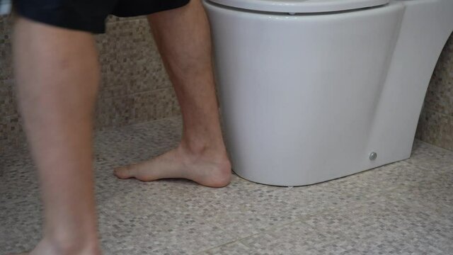 a man sits on the toilet