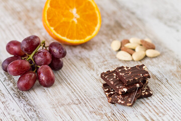 Fototapeta na wymiar Fine chocolate with almonds and fruit