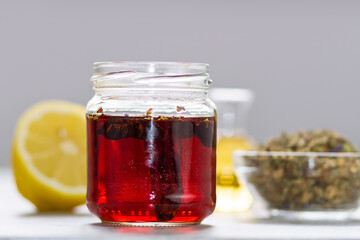 Fototapeta na wymiar An infusion of organic herbs with honey and lemon