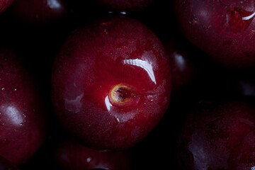 big fresh ripe black cherry super macro photo with blurred background