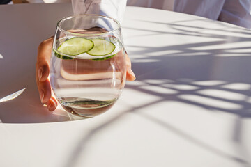 Fresh summer season detox drink with cucumber slices, lime and mint.