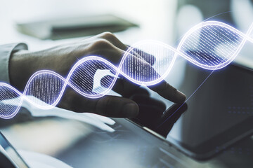 Creative concept with DNA symbol illustration and finger clicks on a digital tablet on background. Genome research concept. Multiexposure